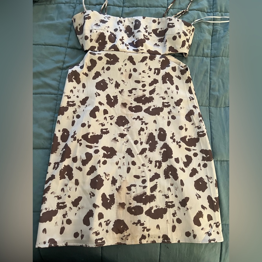 Size M dress. Has slits on the sides where it does show skin